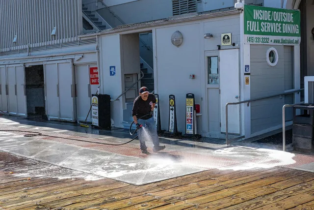 Pressure washing a commercial building walkway in Boise, ID